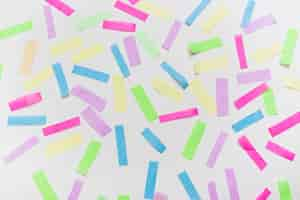 Free photo colorful confetti on gray background