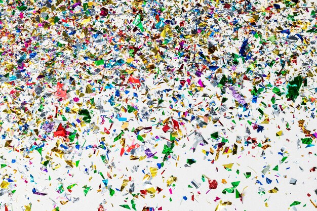 Colorful confetti pattern on a gray wallpaper