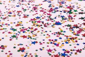 Free photo colorful confetti stars on the background