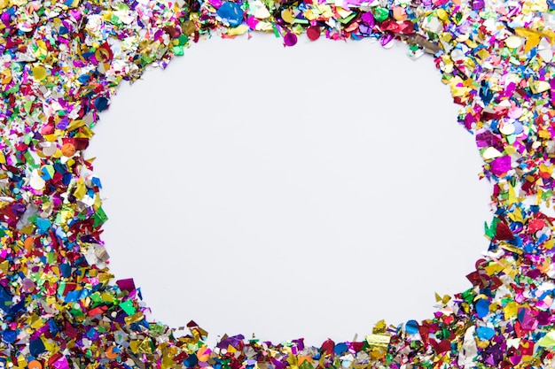 Colorful confetti with copyspace for writing text on white backdrop