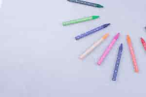 Free photo colorful crayons isolated on grey surface