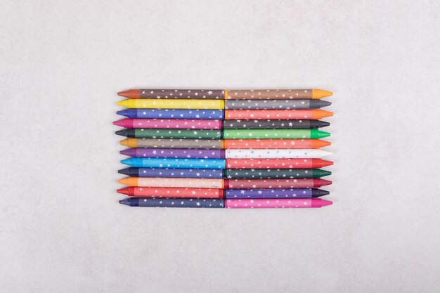 Colorful crayons on white background