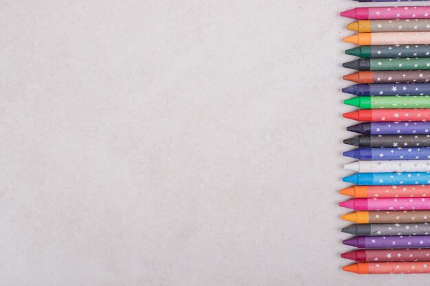 Colorful crayons on white background