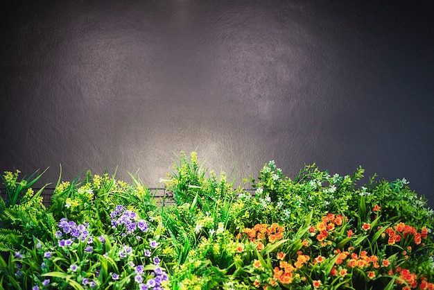 Colorful decorated flower garden with grey copy space on top and warm shiny spot light - flower garden picture