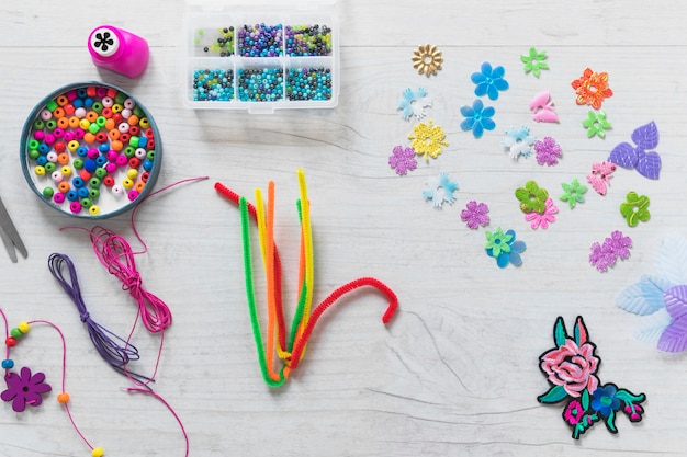 Colorful decorative elements on wooden white textured backdrop