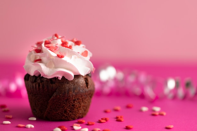 Colorful delicious cupcake with frosting on top