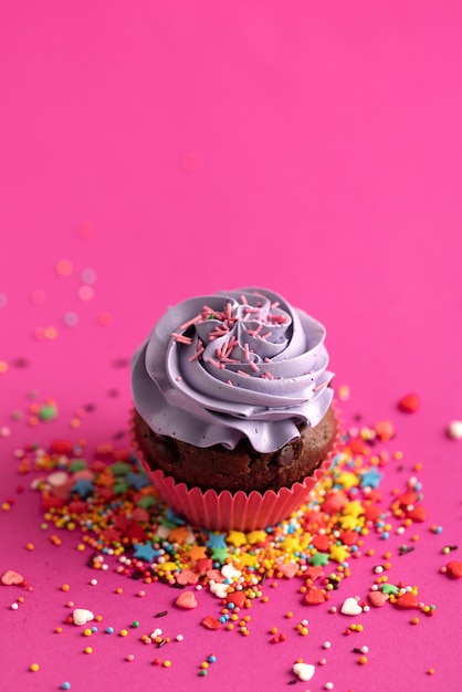 Free photo colorful delicious cupcake with frosting on top