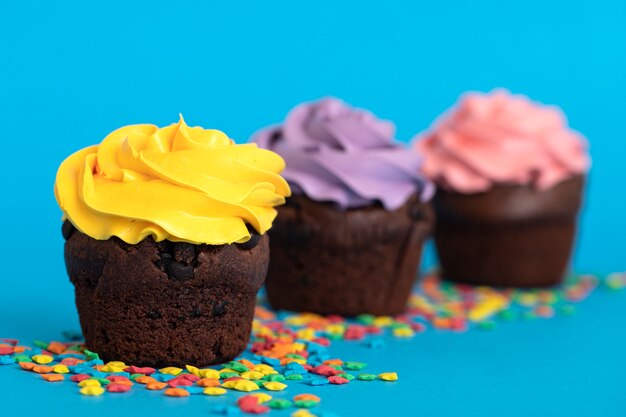 Colorful delicious cupcakes with frosting