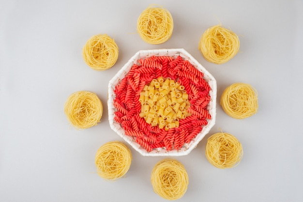 Colorful delicious raw macaroni on plate