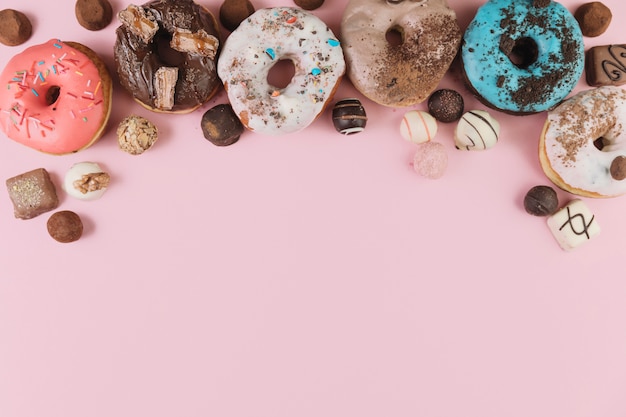 Colorful donuts with chocolates