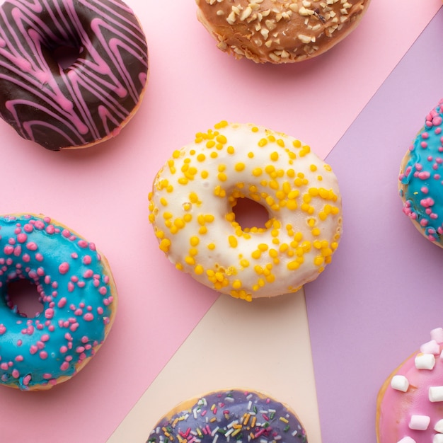 Colorful donuts with sprinkles close up