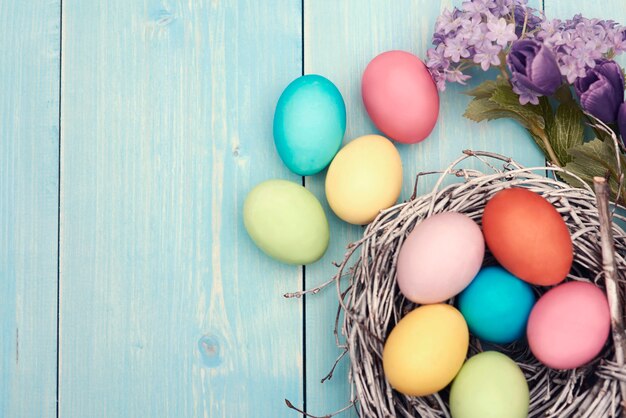 Colorful easter decarations on wooden plank