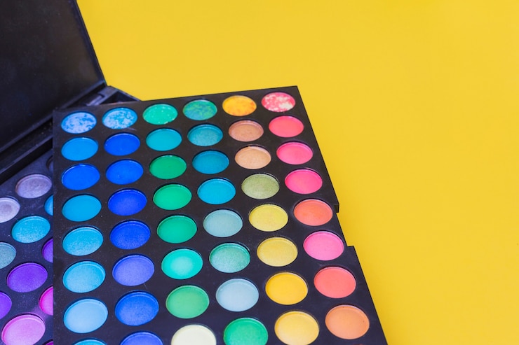 Free Photo colorful eye shadow palette on yellow background
