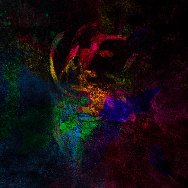 Colorful festival colors spread over dark surface
