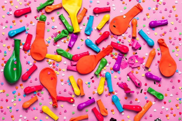 Colorful festive objects on pink background