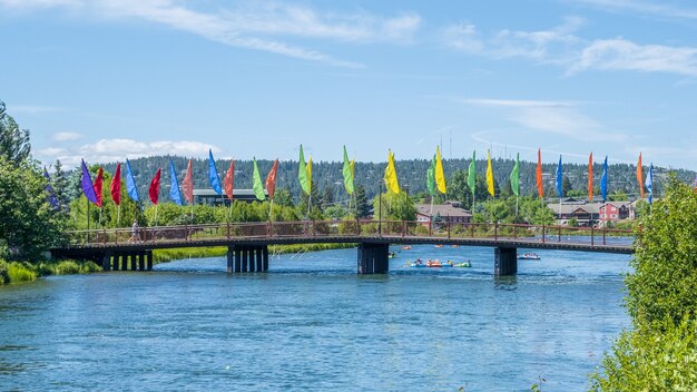 Colorful flags on a bridge