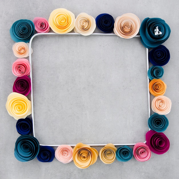 Colorful floral frame on cement background