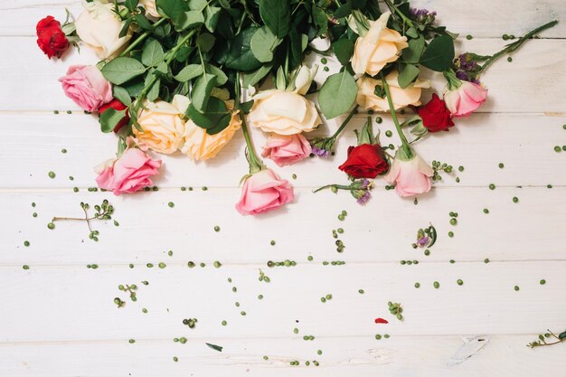 Colorful flowers on wooden table