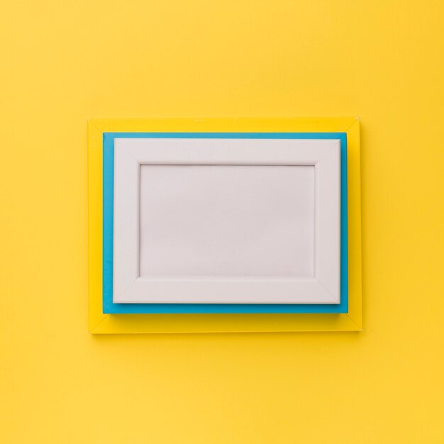 Colorful frames on yellow background