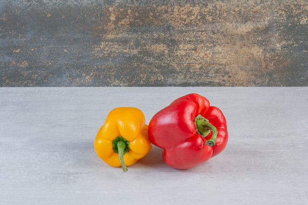 Colorful fresh peppers on marble background. High quality photo