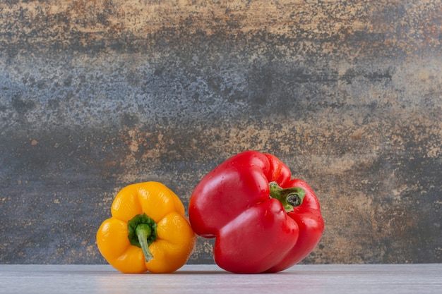 Colorful fresh peppers on marble background. High quality photo