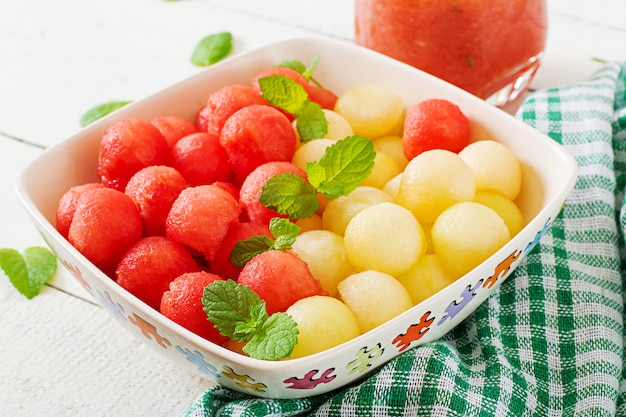 Colorful fruit salad. Watermelon and melon salad. Fresh summer food.