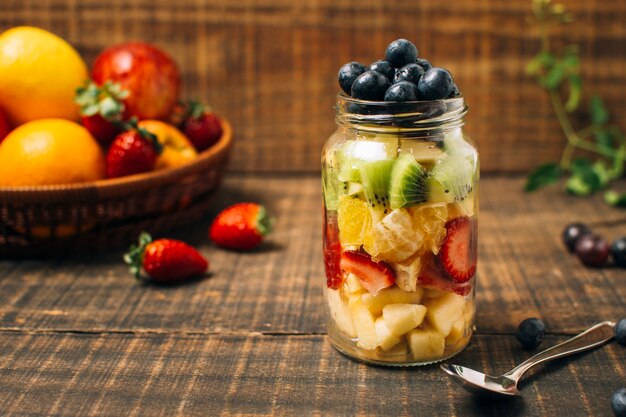 Colorful fruits in a jar