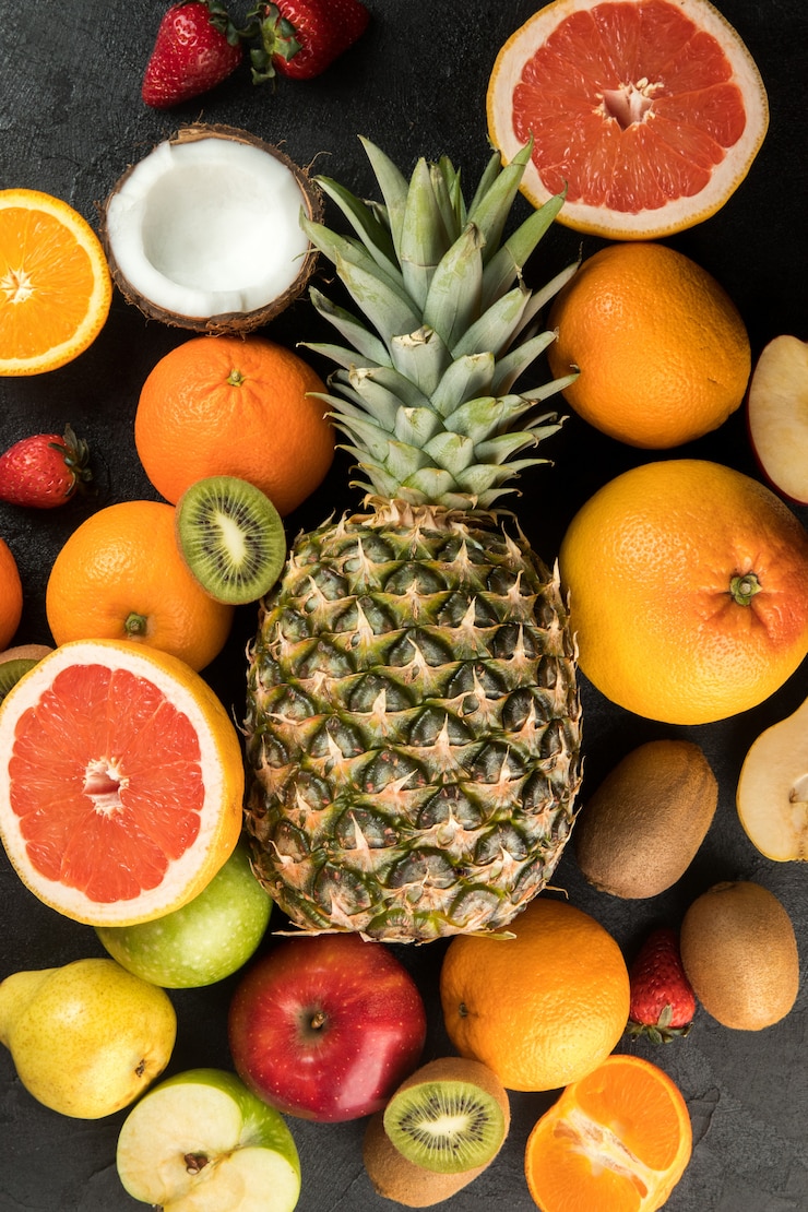 Free Photo colorful fruits vitamine riched yummy mellow juicy isolated on a dark floor