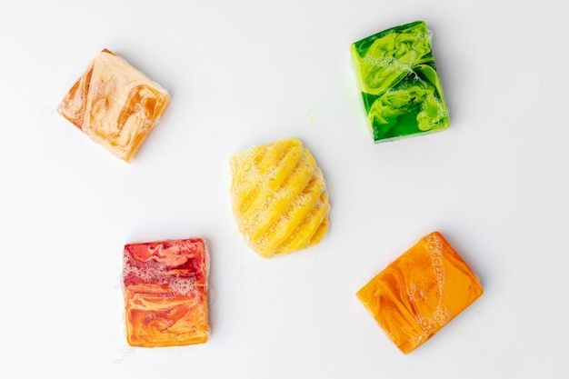 Colorful handmade soap bars on a white background