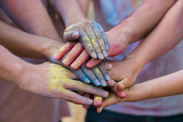 Colorful hands at festival close-up