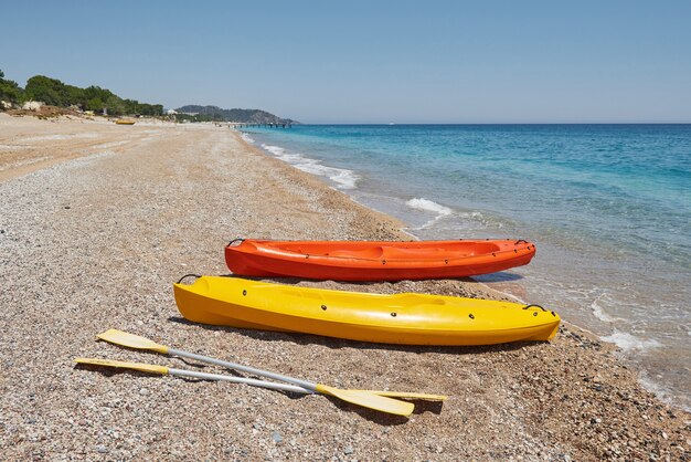 Colorful kayaks on the beach. beautiful landscape.