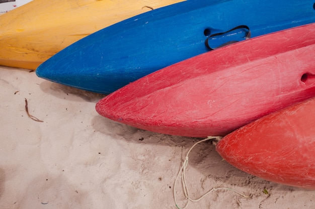 Colorful kayaks on beach
