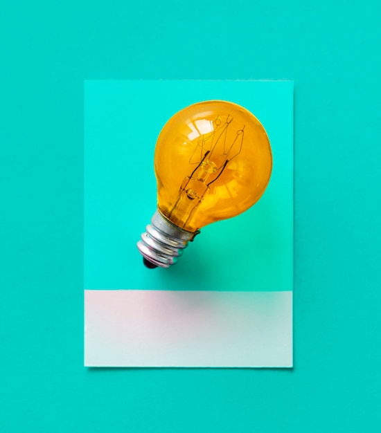 Free photo colorful light bulb on a paper