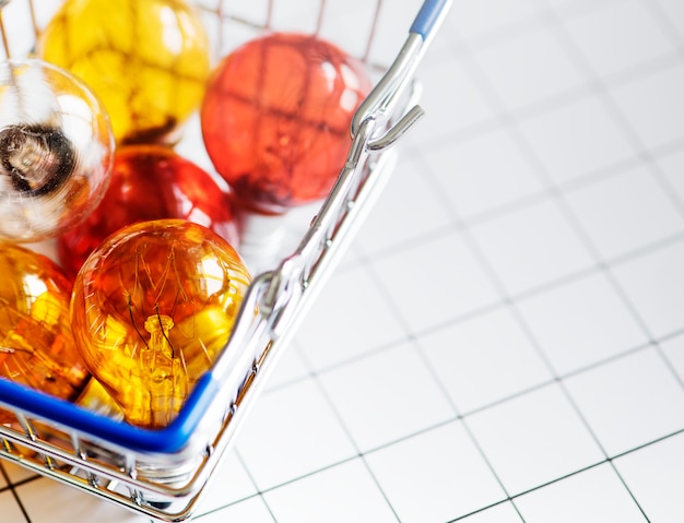 Colorful light bulbs in a basket