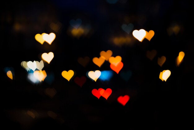 Colorful lights background with heart shapes