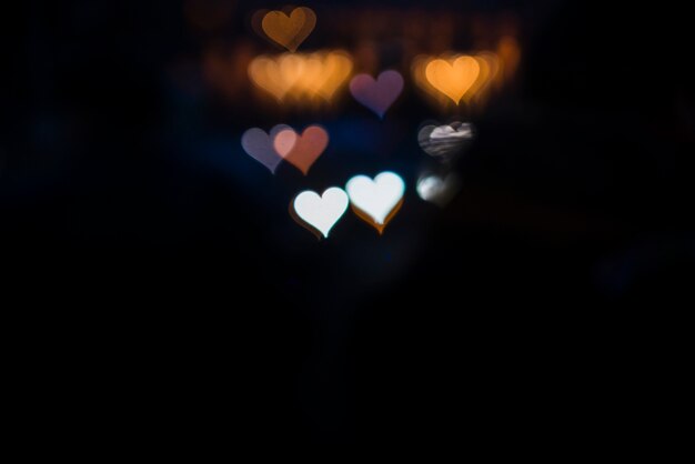 Colorful lights background with two white hearts