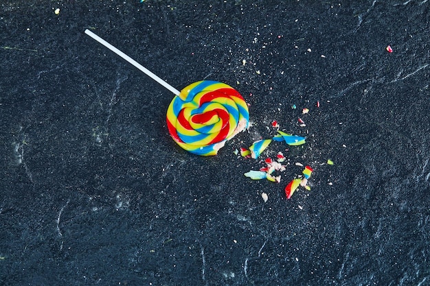 Free photo colorful lollipop on dark background.