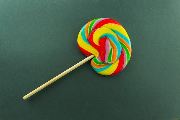 Colorful lollipop on green