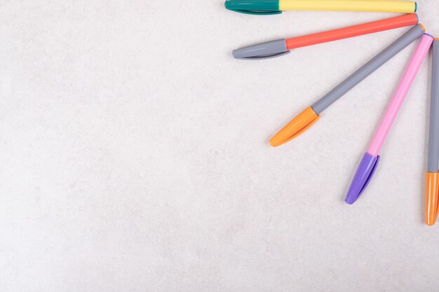 Colorful marker pens on white background