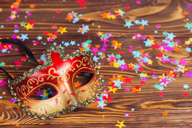 Free photo colorful mask and confetti