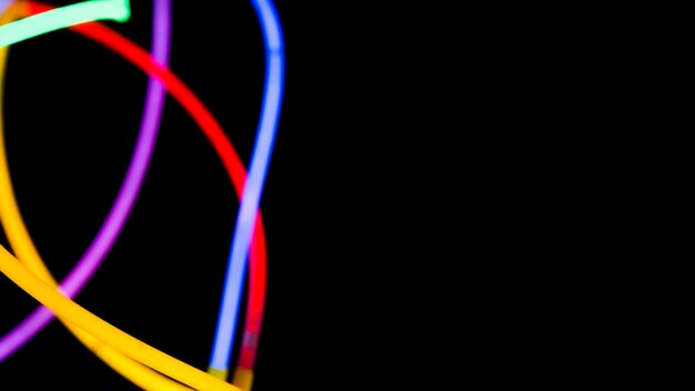 Colorful neon lights on black background