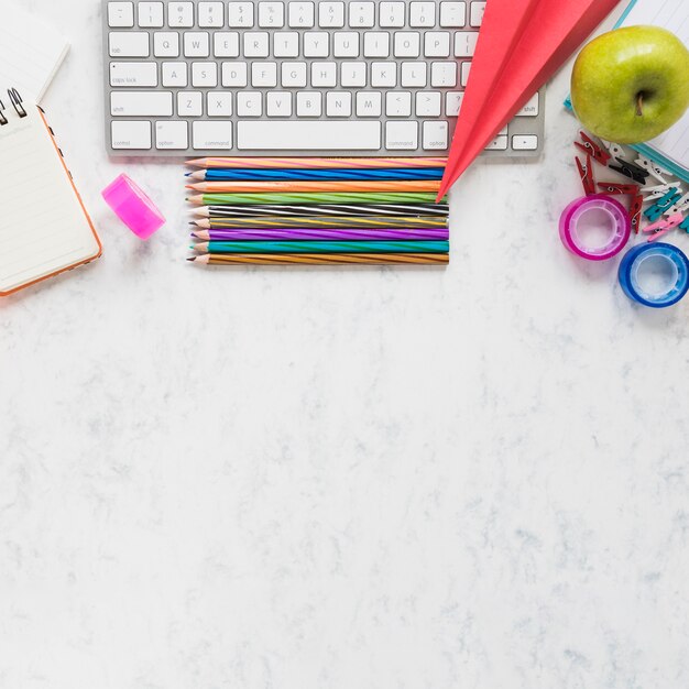 Colorful office supplies on white background