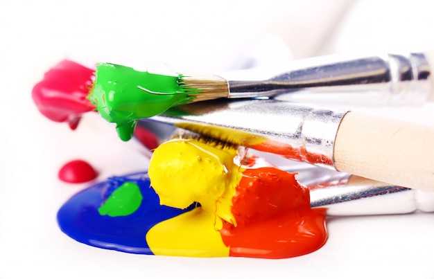 Colorful paint and brushes