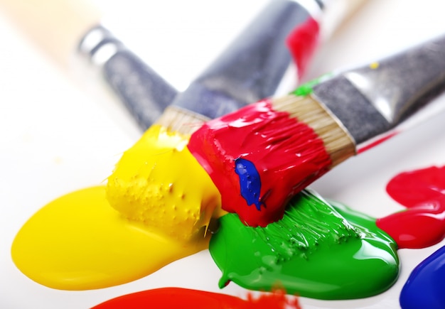 Colorful paint and brushes