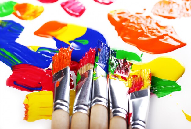 Colorful paint and brushes