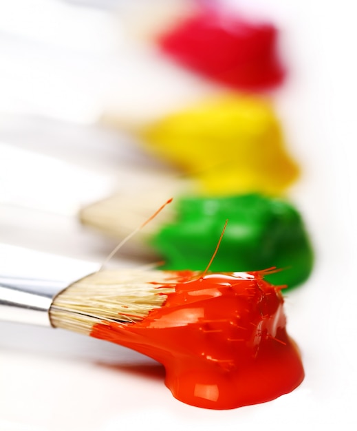 Colorful paint and brushes