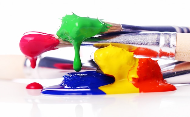 Free photo colorful paint and brushes