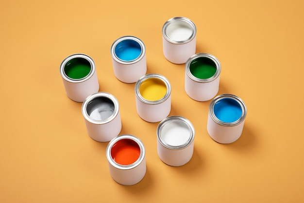 Colorful paint cans assortment high angle