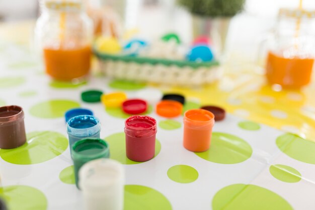 Colorful paints on table