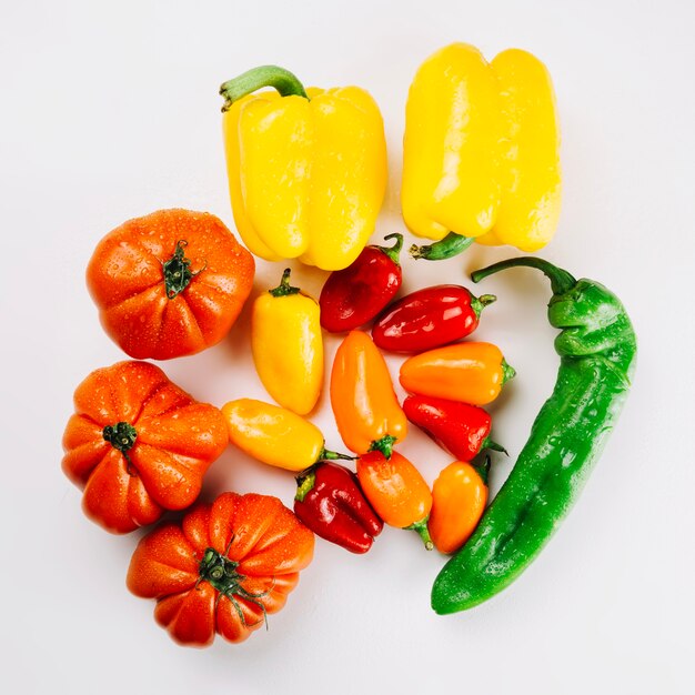 Colorful peppers on white background